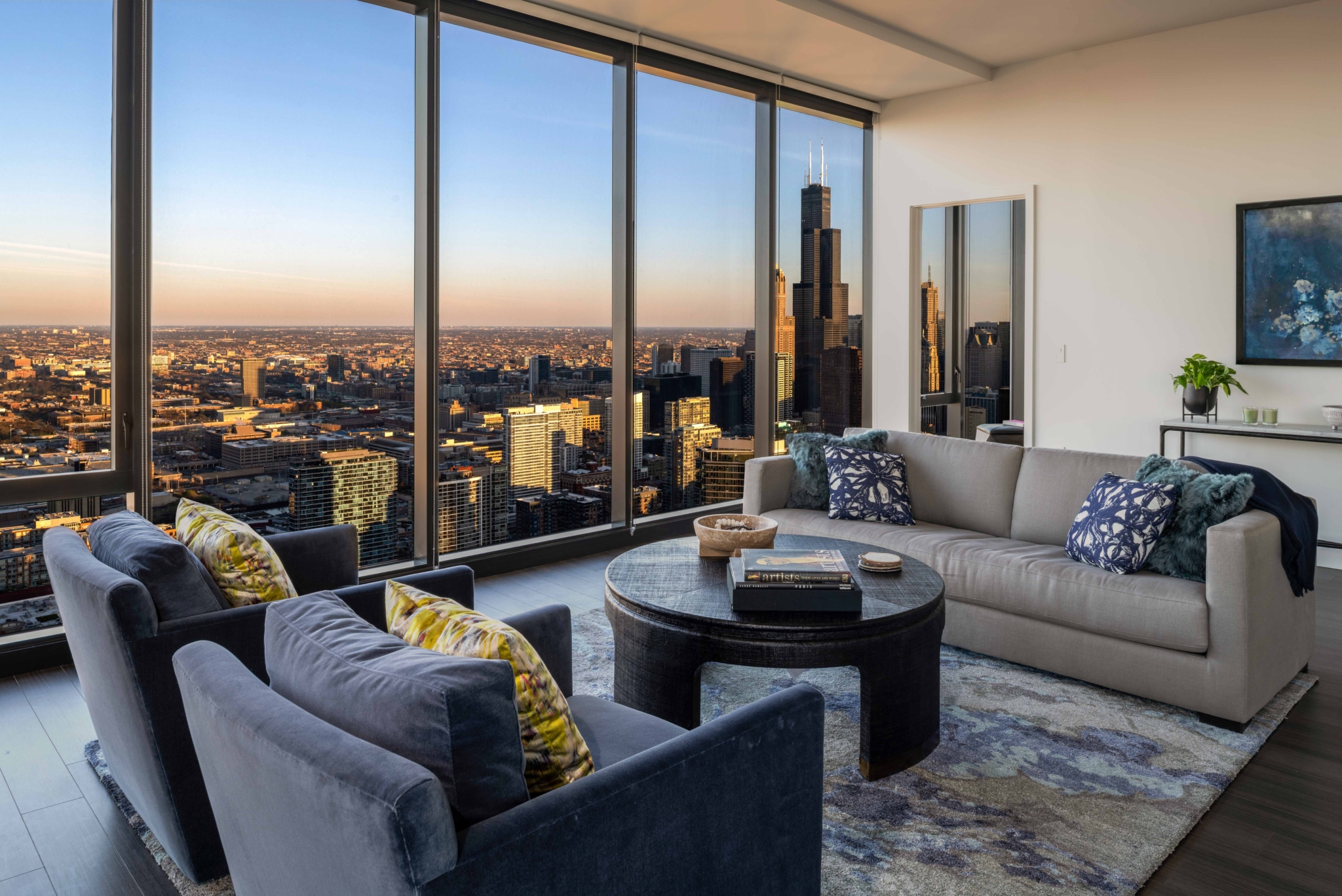 High-rise residence living room with floor-to-ceiling windows over the Chicago skyline
